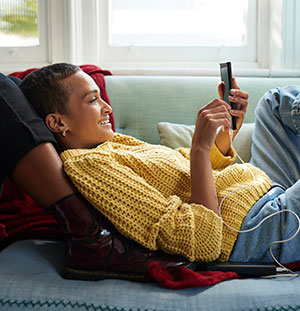 Woman texting and smiling