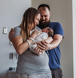 Parents holding newborn