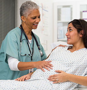 Doctor examines pregnant woman