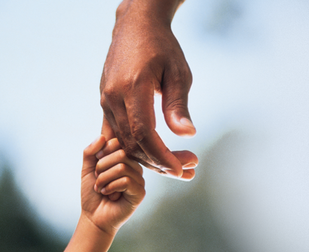 Child hand holding grabbing adult hand